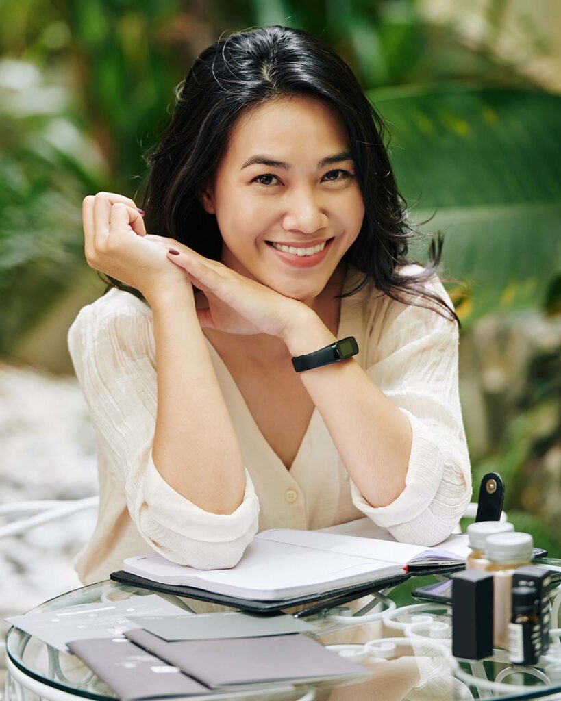 lovely young woman sitting at table G6CUGES